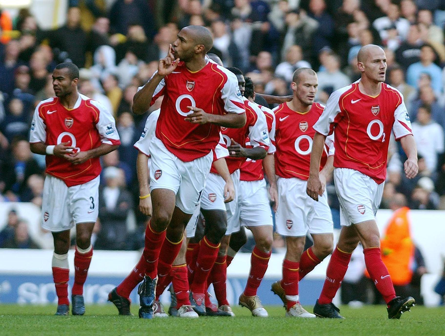 Thierry Henry scored Arsenal's first goal as they hit five past Spurs in an enthralling league win.