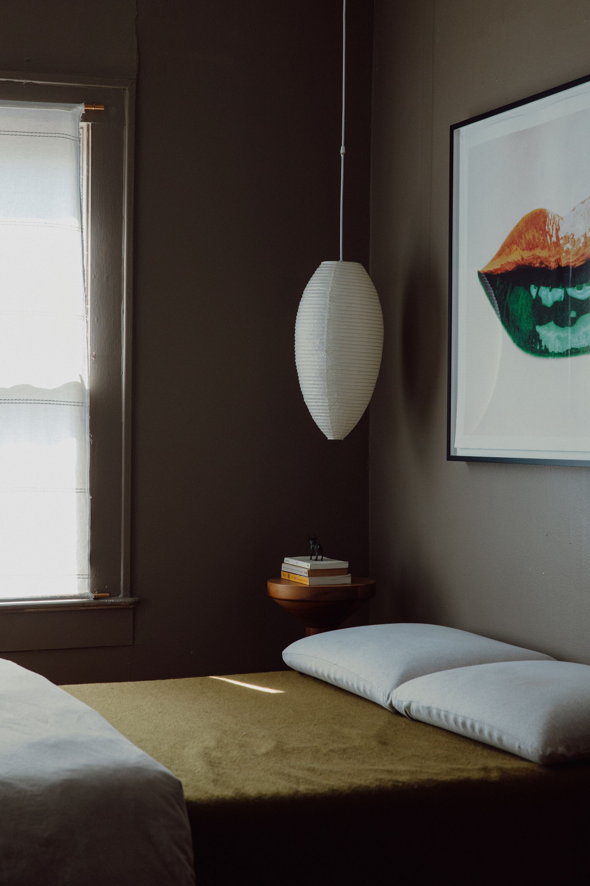 A small bedroom with saved night stand space