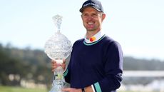 Justin Rose with the trophy after winning the 2023 Pebble Beach Pro-Am