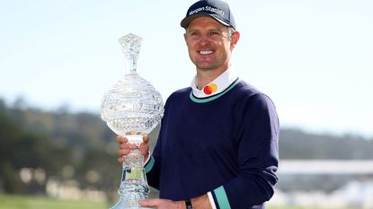 Justin Rose with the trophy after winning the 2023 Pebble Beach Pro-Am