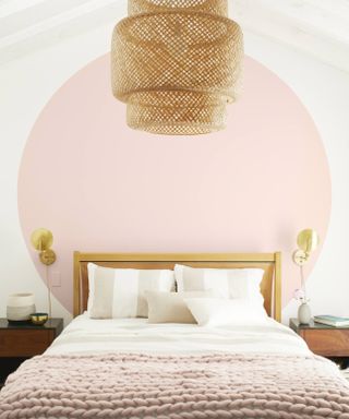 bedroom with pink circle color block feature wall