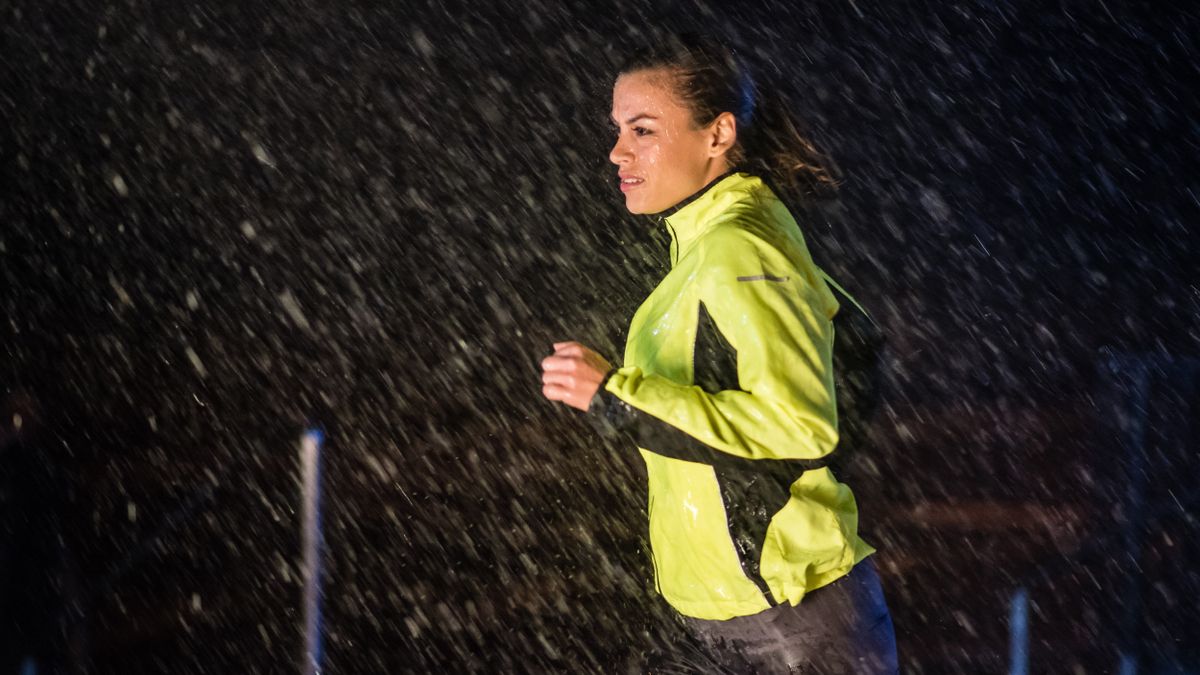 Woman running in the rain