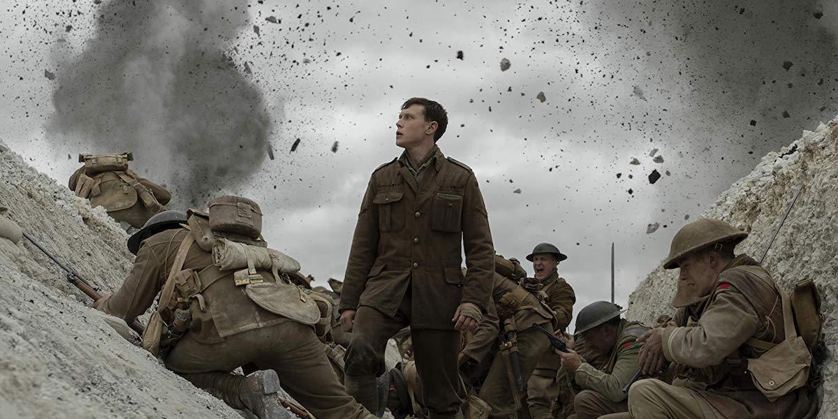 William Schofield (George MacKay) standing and watching an explosion in 1917