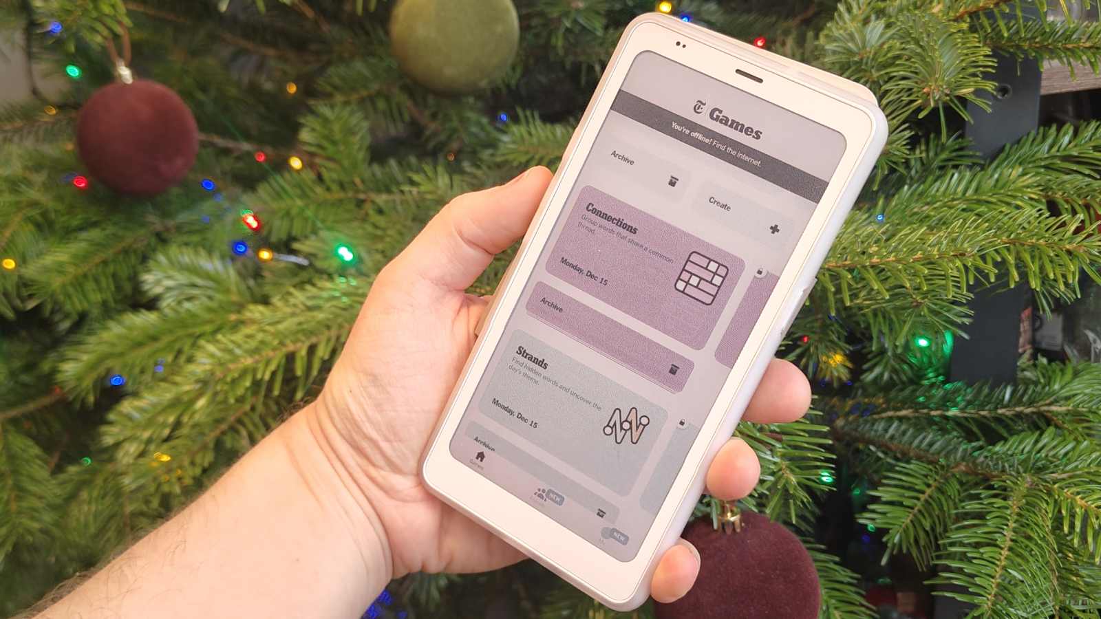 The Boox Palma 2 Pro showing the NYT Games app.