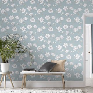 room with wallpaper and potted plant