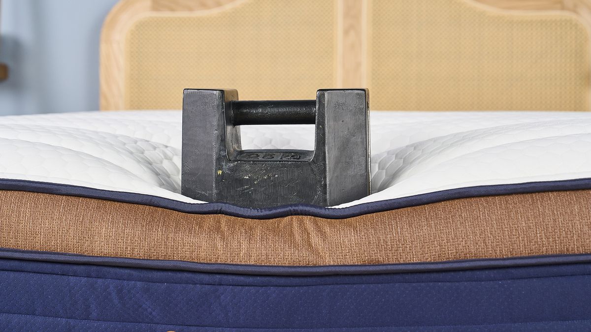 A weight placed on the edge of the Brooklyn Bedding CopperFlex Pro mattress