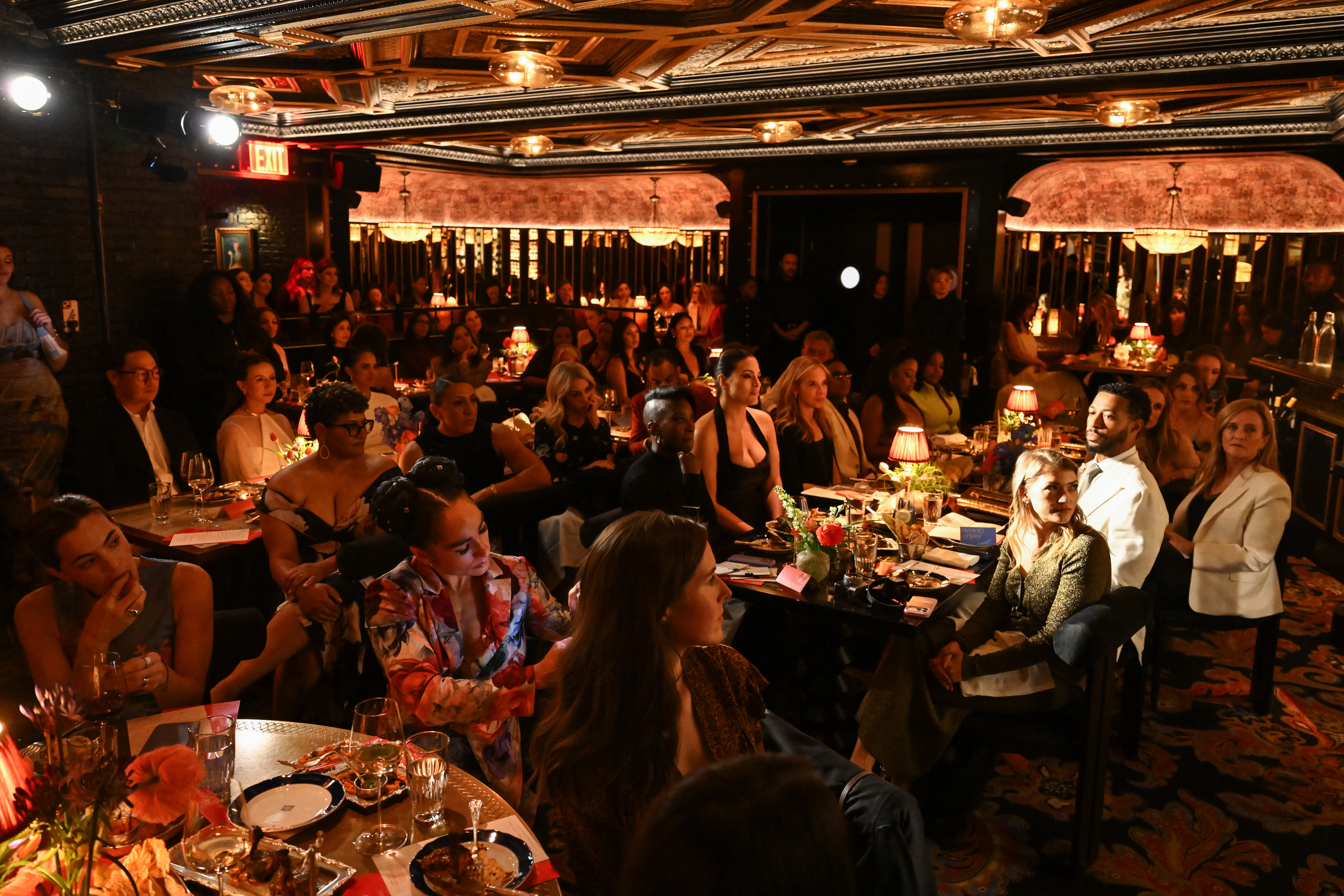 Guests attend a Marie Claire and Moms First dinner.