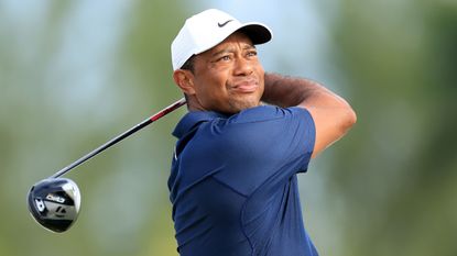 Tiger Woods takes a shot during the pro-am before the Hero World Challenge
