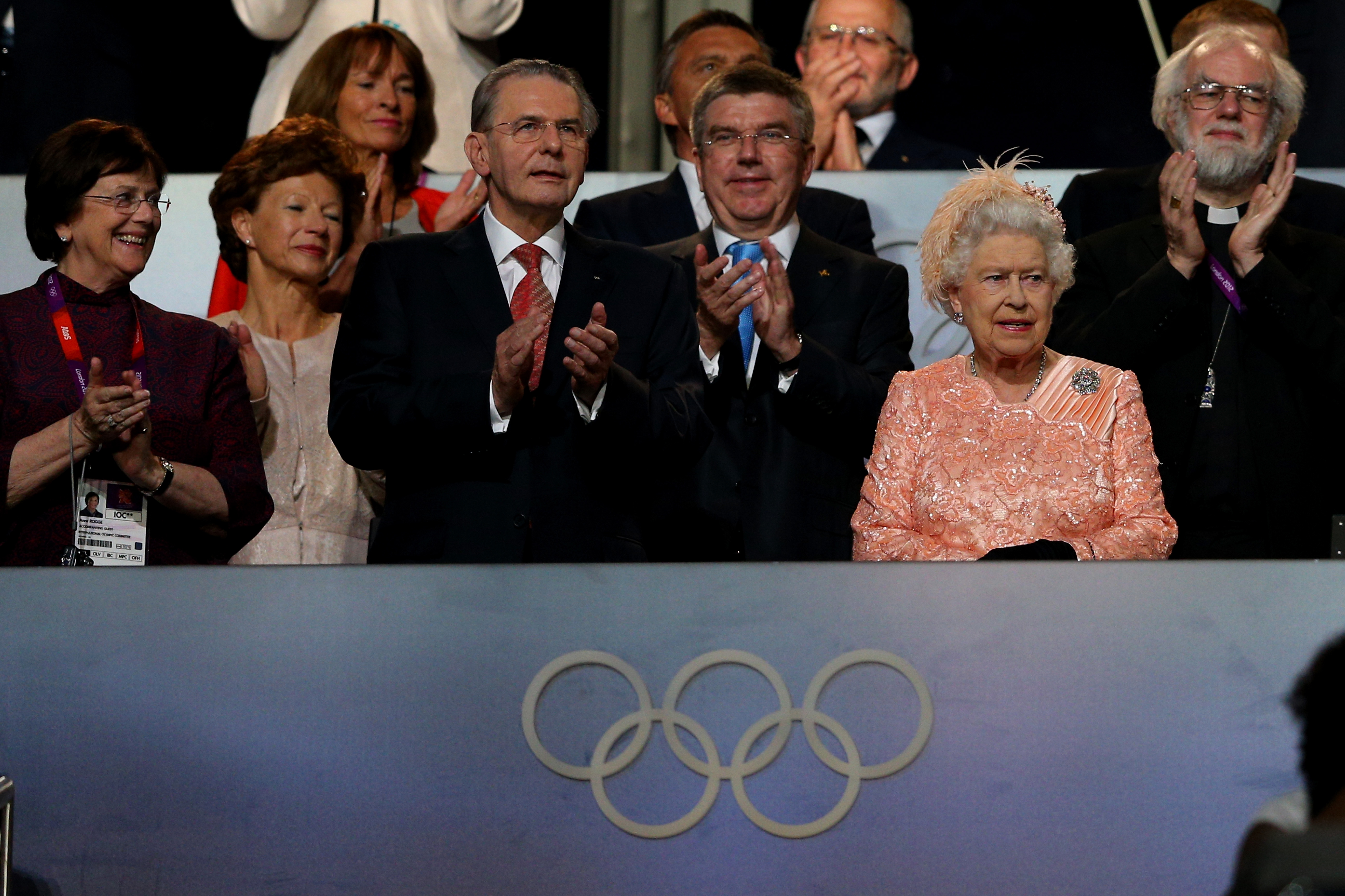 Queen Elizabeth at the 2012 Olympics in a peach dress