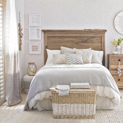 bedroom with shutter windows and wooden vanity