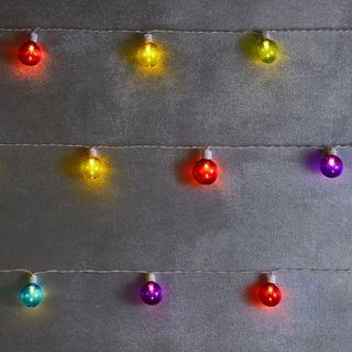 grey wall with light on bulb