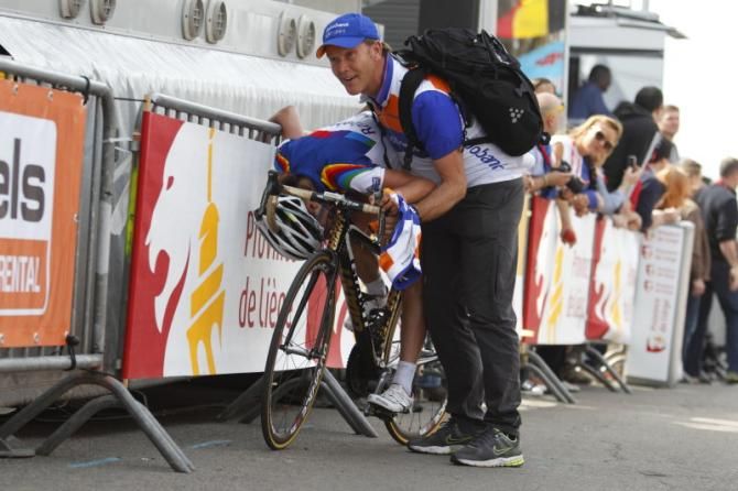 It wasn't easy.... Marianne Vos (Rabo Women) is held up whilst doubled-over on her bike, metres after the finish line