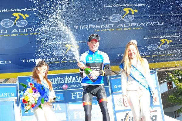 Still all to play for: Chris Horner unleashes the sparkling wine, but is all too aware that with Nibali and Kreuziger so close, the Tour is still yet to be wrapped up.