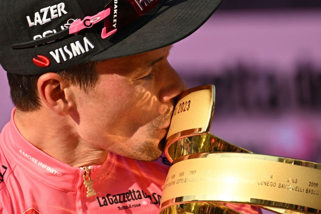JumboVismas Slovenian rider Primoz Roglic kisses the races winners Trofeo Senza Fine Endless Trophy as he celebrates on the podium after winning the Giro dItalia 2023 cycling race in Rome on May 28 2023 Photo by Alberto PIZZOLI AFP Photo by ALBERTO PIZZOLIAFP via Getty Images