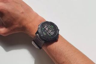 Male cyclist wearing a Coros Vertix 2 smartwatch