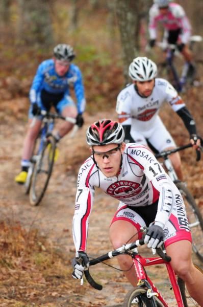 Tyler Trace (Trek Red Truck) exiting the singletrack