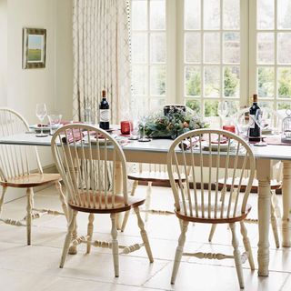 Dining area with neutral walls and festive table setting