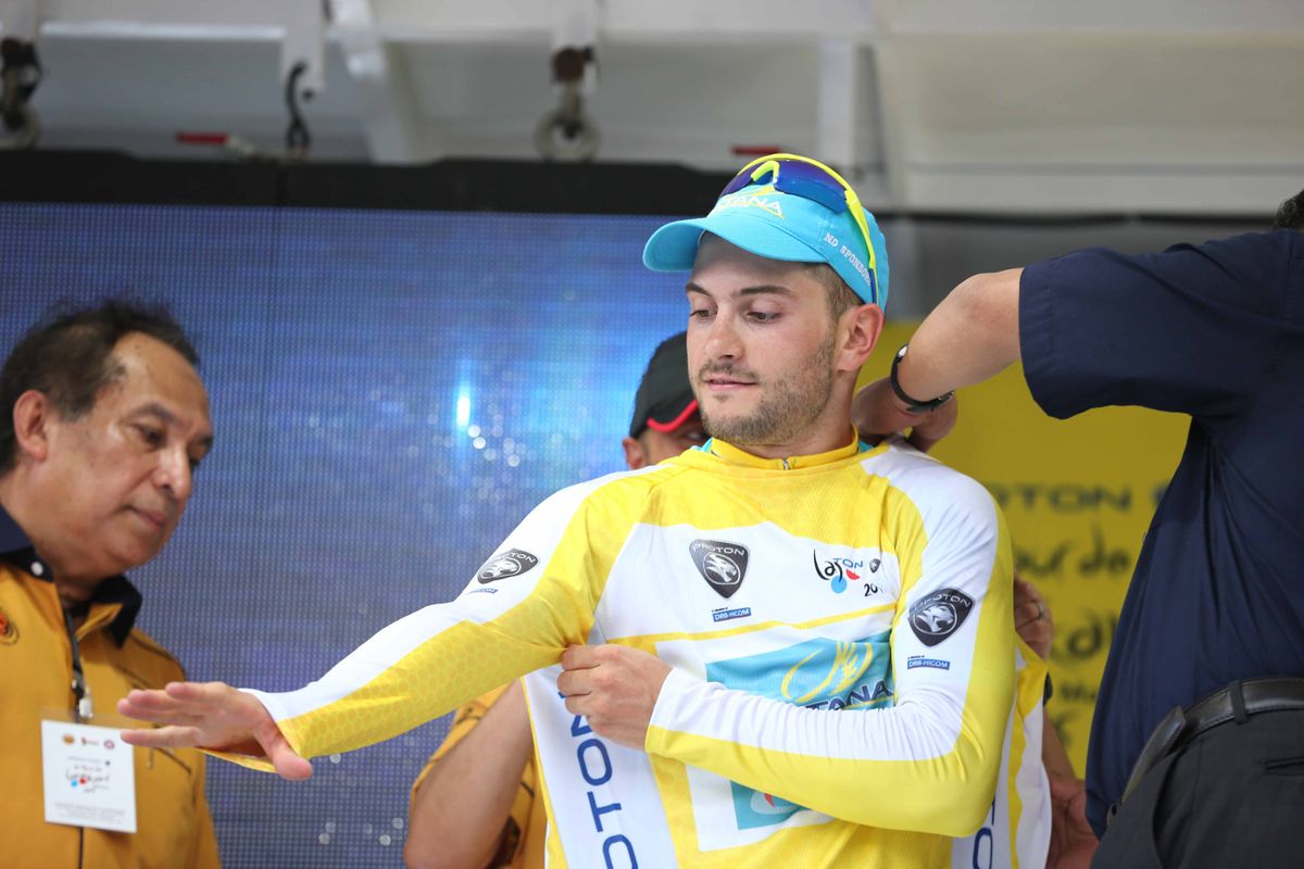 Andrea Guardini (Astana) pulls on the yellow jersey