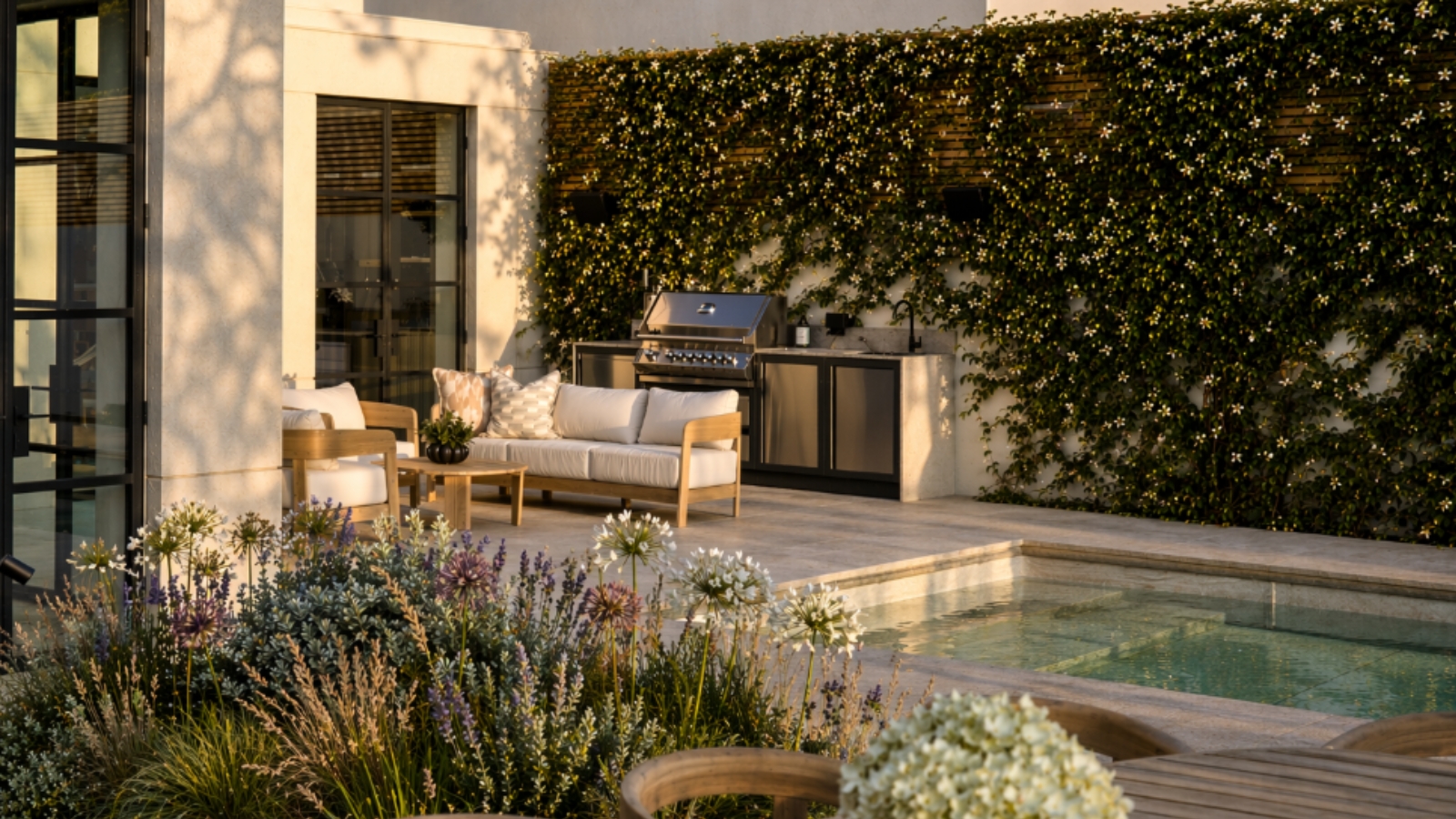 A modular outdoor kitchen next to a pool