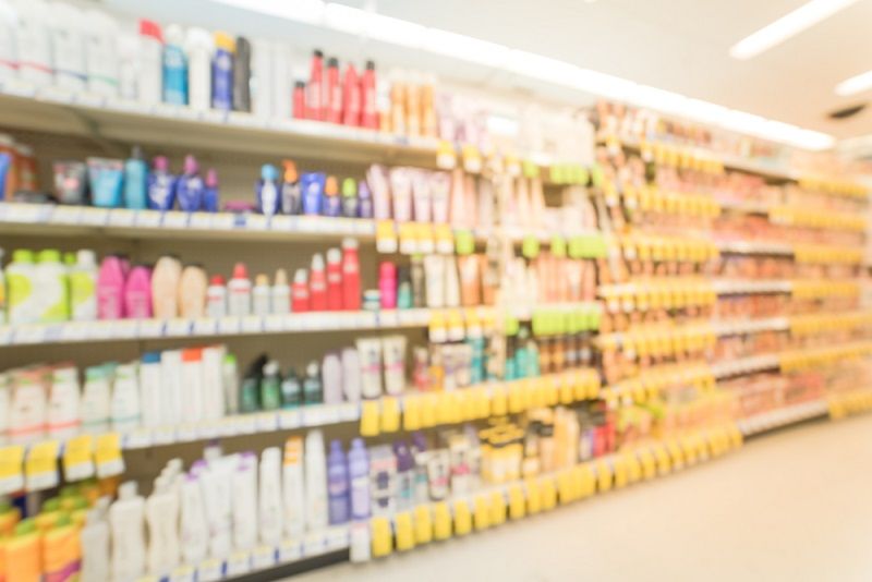 Sunscreen and other skin care products at a pharmacy store.