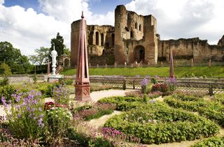 Britain's most romantic places to visit: the elizbethan garden at kenilworth castle with the castle in the background