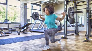 Woman lifting weights at gym