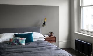 a bedroom wall painted in shades of grey paint
