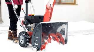 Person using a snow blower