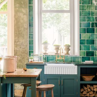 kitchen with green handmade tile wall and fluted butlers sink