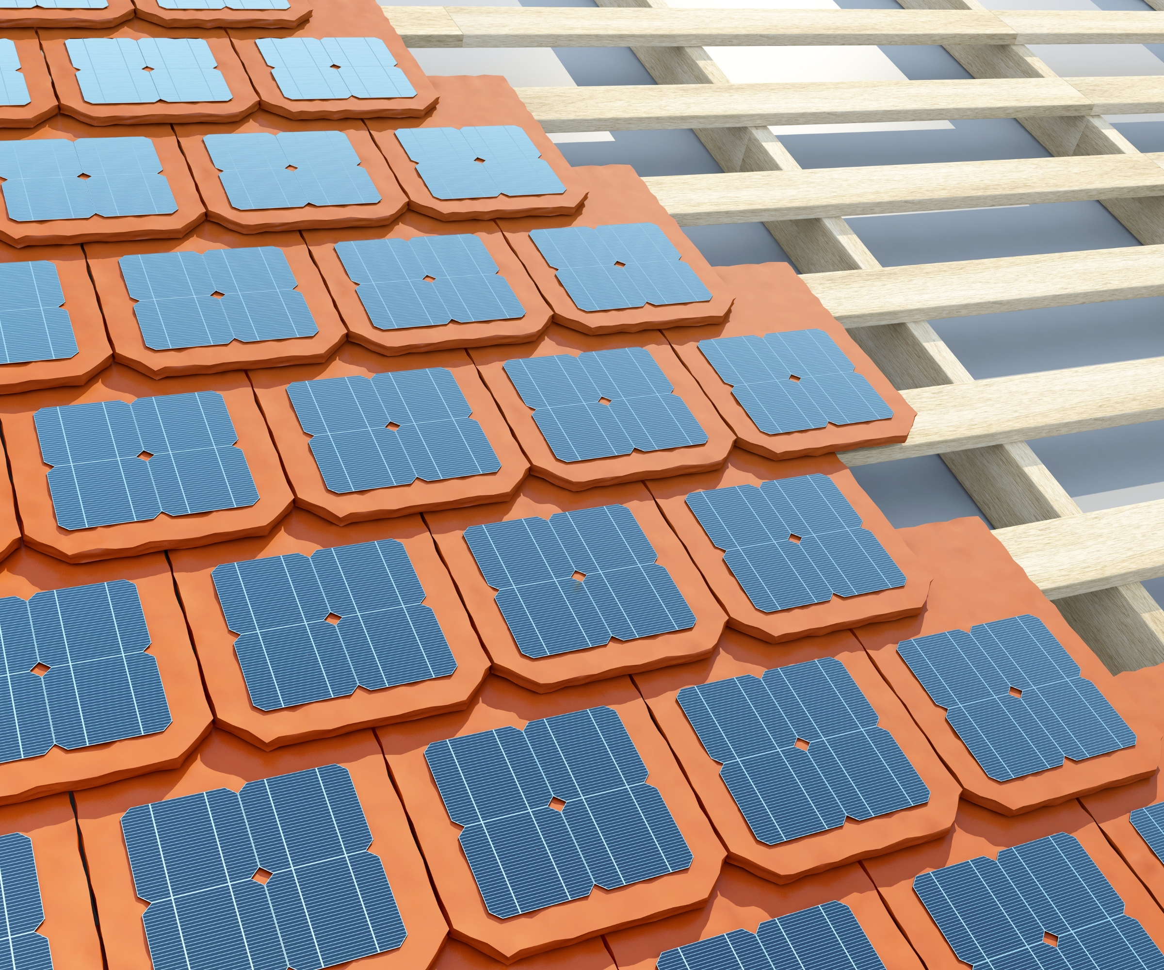 Solar tiles close-up, in the process of being applied to a roof. The sunshine reflects off them.