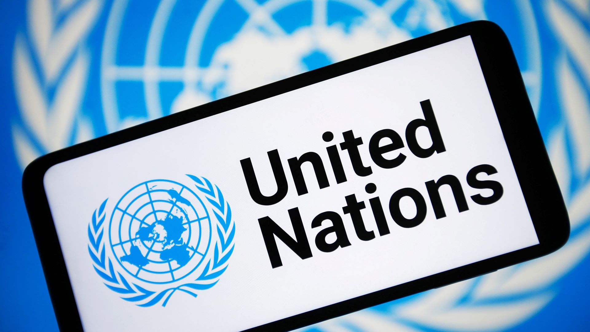 In this photo illustration, The United Nations (UN) logo is seen on a smartphone screen.