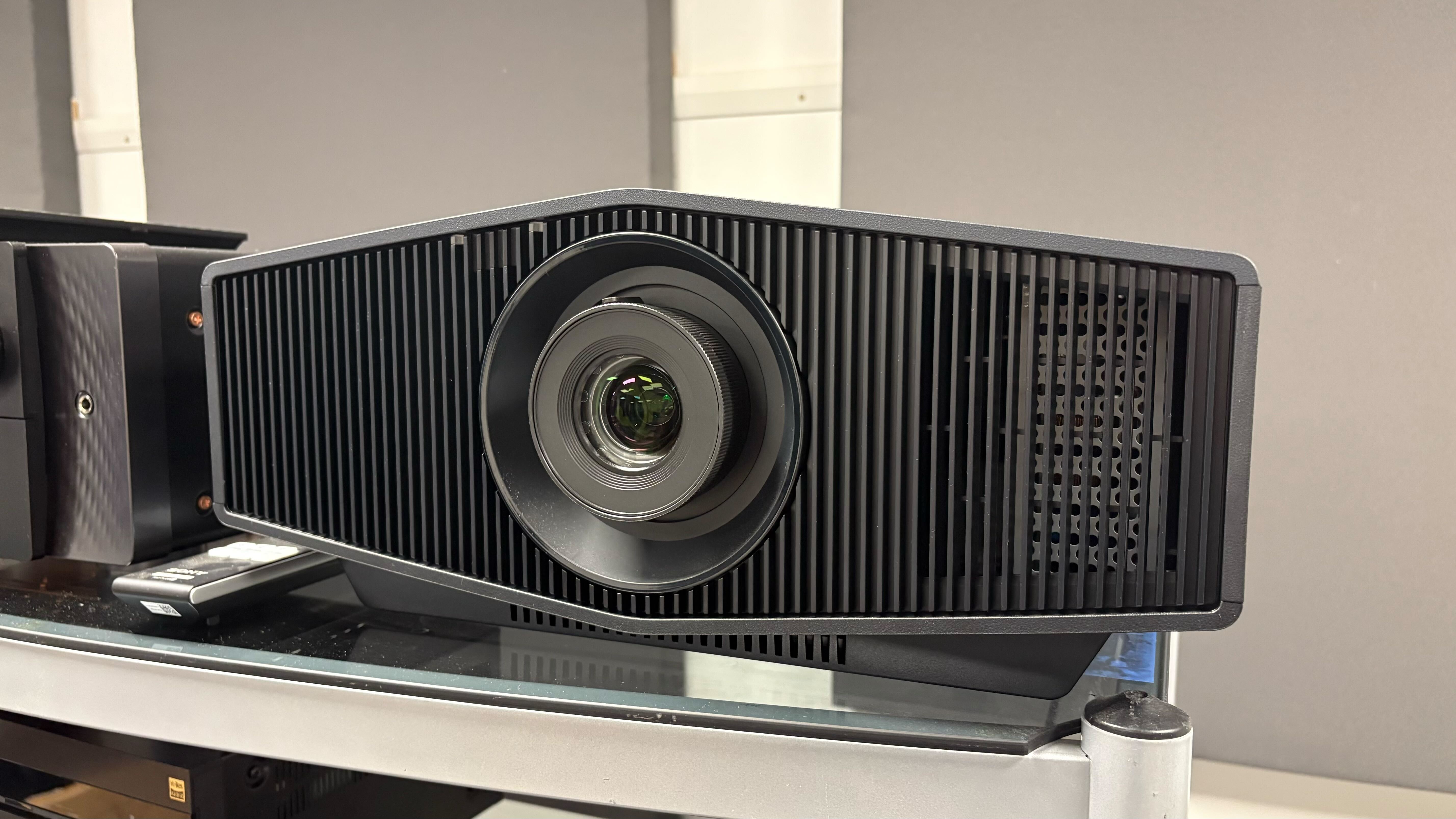 Sony projector in black on a metal and glass stand