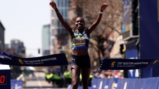 Sharon Lokedi of Kenya crosses the finish line to win the Boston Marathon in 2025