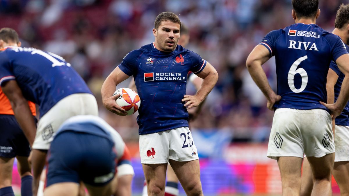 Antoine Dupont stand with the rugby ball under his arm, wearing the France blue shirt and white shorts strip, ahead of Olympic Rugby Sevens. 