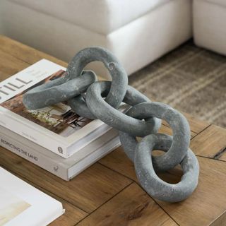 A large concrete link on a coffee table
