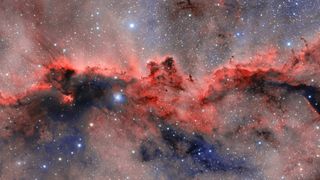 an image of a nebula with a red horizontal cloud that resembles two dragons