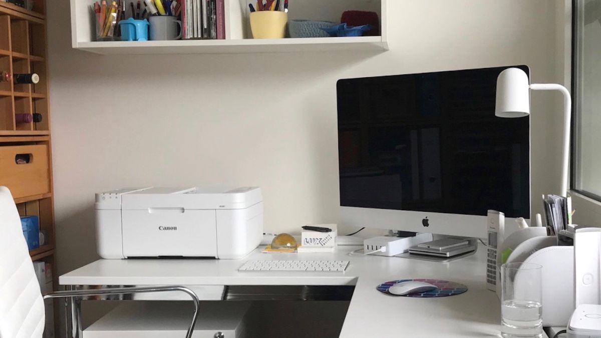 Printer and computer on desk