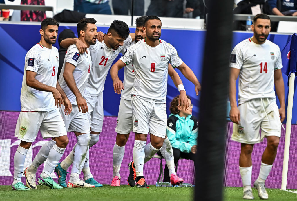 Mohammad Mohebbi (#21) of Iran is celebrating with his teammates