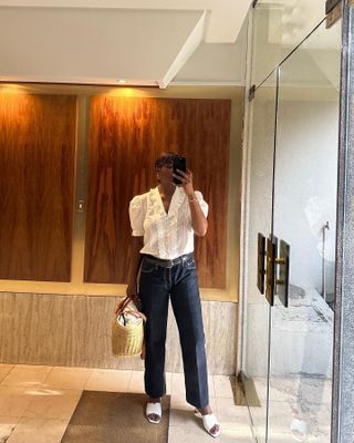 Influencer wears a white blouse.