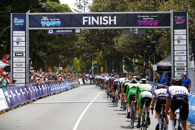 The peloton crosses through the line for another lap