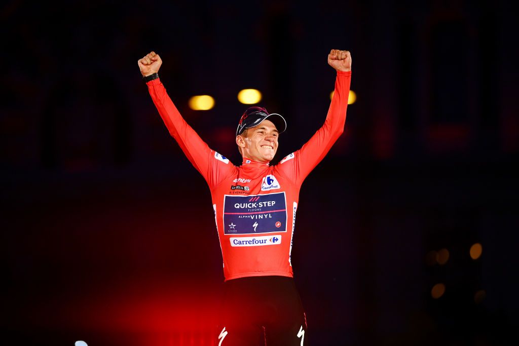 MADRID SPAIN SEPTEMBER 11 Remco Evenepoel of Belgium and Team QuickStep Alpha Vinyl celebrates winning the Red Leader Jersey on the podium ceremony after the 77th Tour of Spain 2022 Stage 21 a 967km stage from Las Rozas to Madrid LaVuelta22 WorldTour on September 11 2022 in Madrid Spain Photo by Tim de WaeleGetty Images