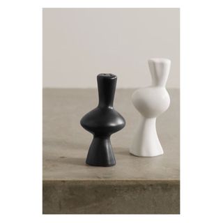 sculpture like black and white salt and pepper shakers