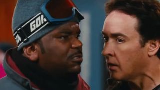 Craig Robinson and John Cusack looking angry as they talk very closely to each other in Hot Tub Time Machine