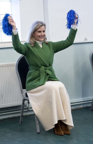 Sophie, Duchess of Edinburgh takes part in seated dancing during a visit to the Katherine Low Settlement on January 16, 2024 in London, England.