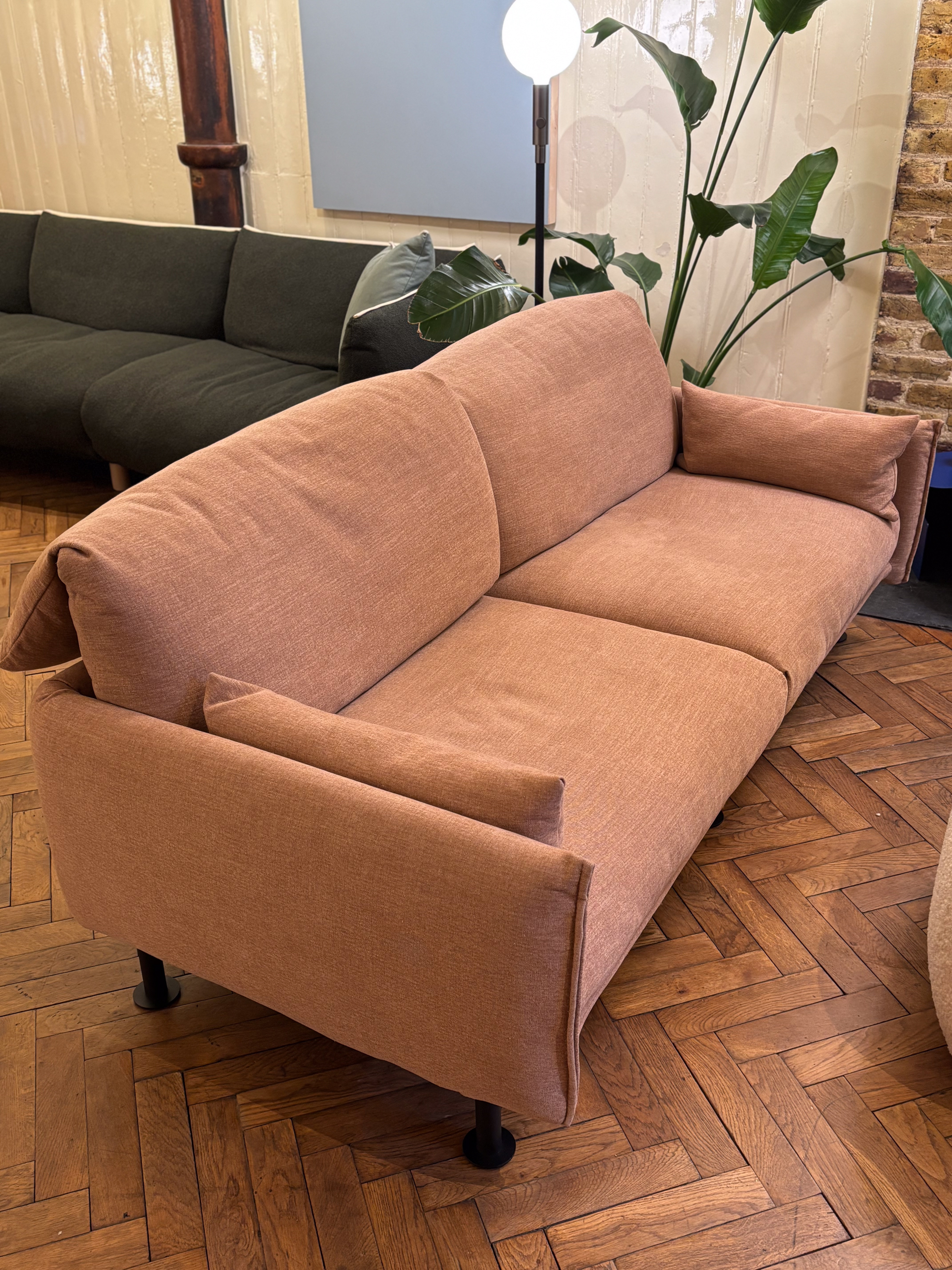 a light pink sofa in a furniture showroom