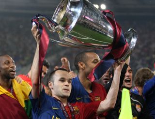 Andres Iniesta celebrates with the Champions League trophy after Barcelona's win over Manchester United in the 2009 final.