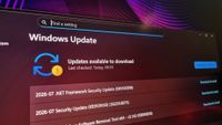 A photo of a gaming monitor displaying queued Windows updates