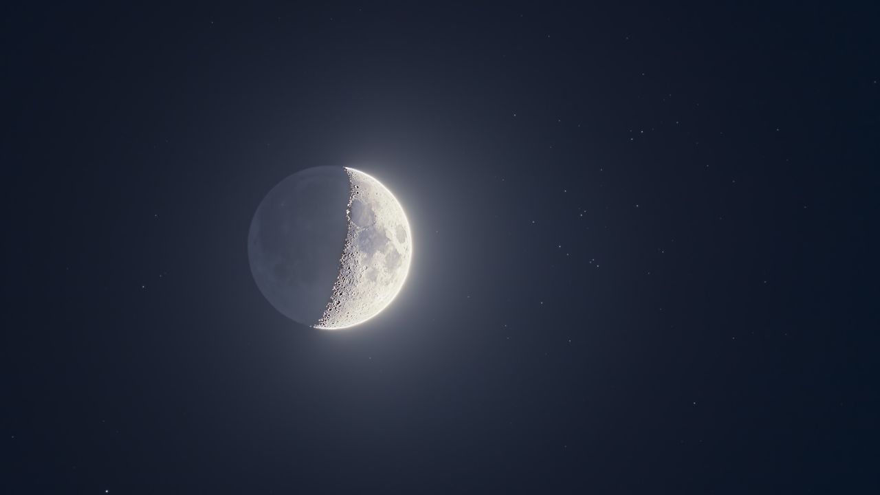 The moon shines with a swarm of stars on May 21 as Jupiter, Venus and Mercury line-up nearby