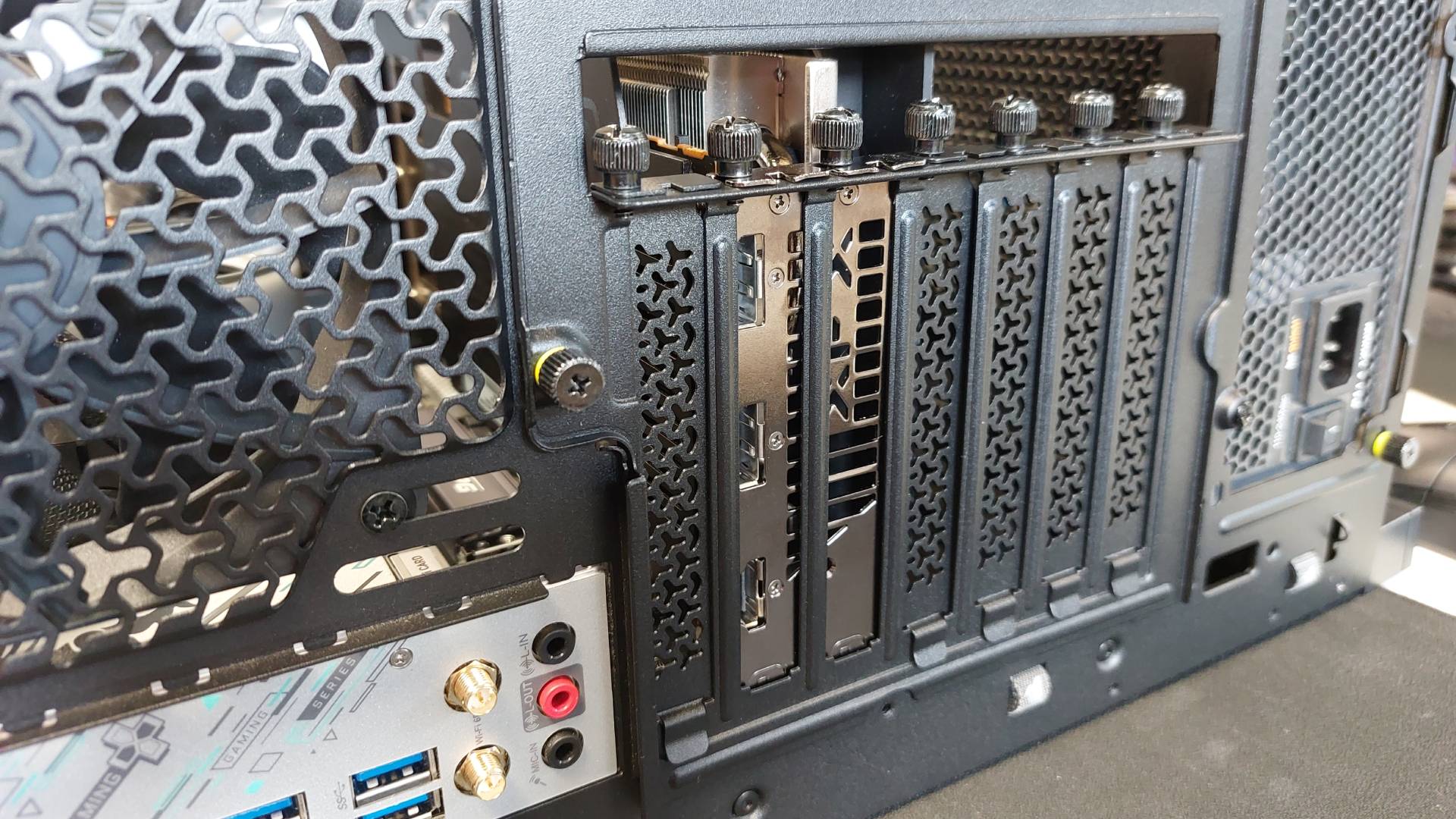 The Corsair Frame 4000X PC case seen at various stages of a PC build. This is a modular, mid-tower case with lots of options for customisation.