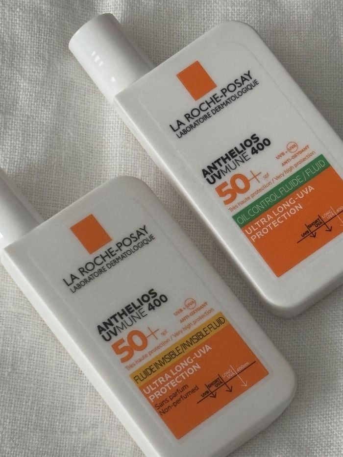 A picture of two of the La Roche-Posay SPFs on a white linen background